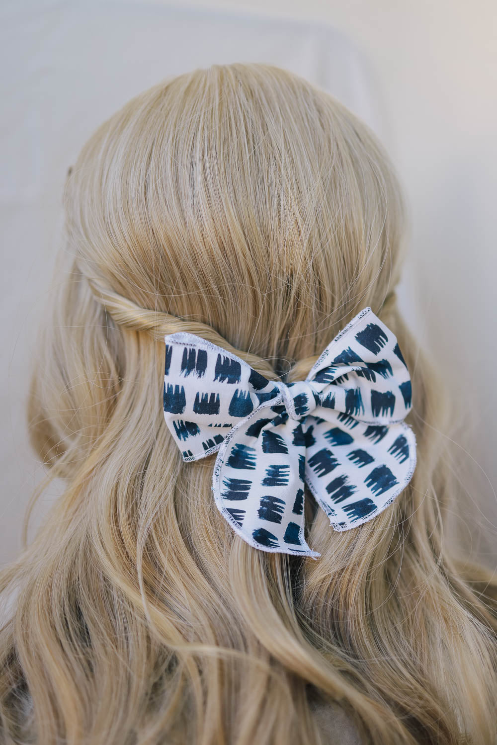 Edgy Black and White Serged Trim Bow with Alligator Clip
