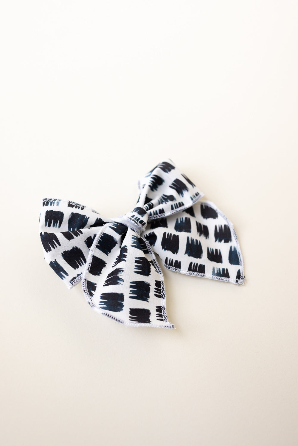 Edgy Black and White Serged Trim Bow with Alligator Clip