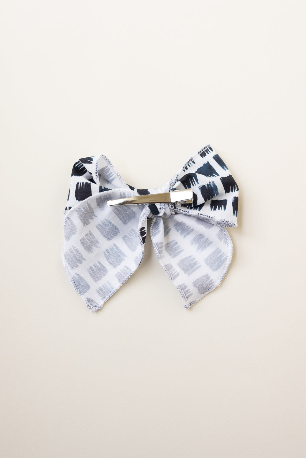Edgy Black and White Serged Trim Bow with Alligator Clip