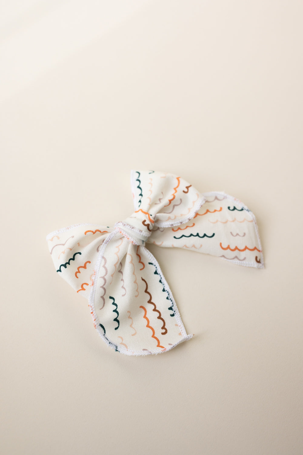 Hand crafted Retro Style Color wave Serged bow with Alligator clip