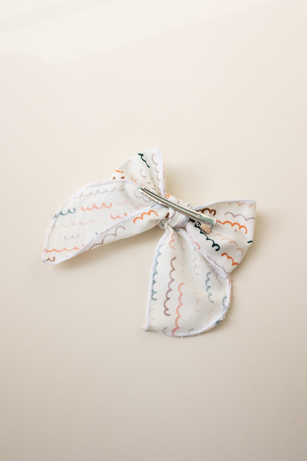 Hand crafted Retro Style Color wave Serged bow with Alligator clip