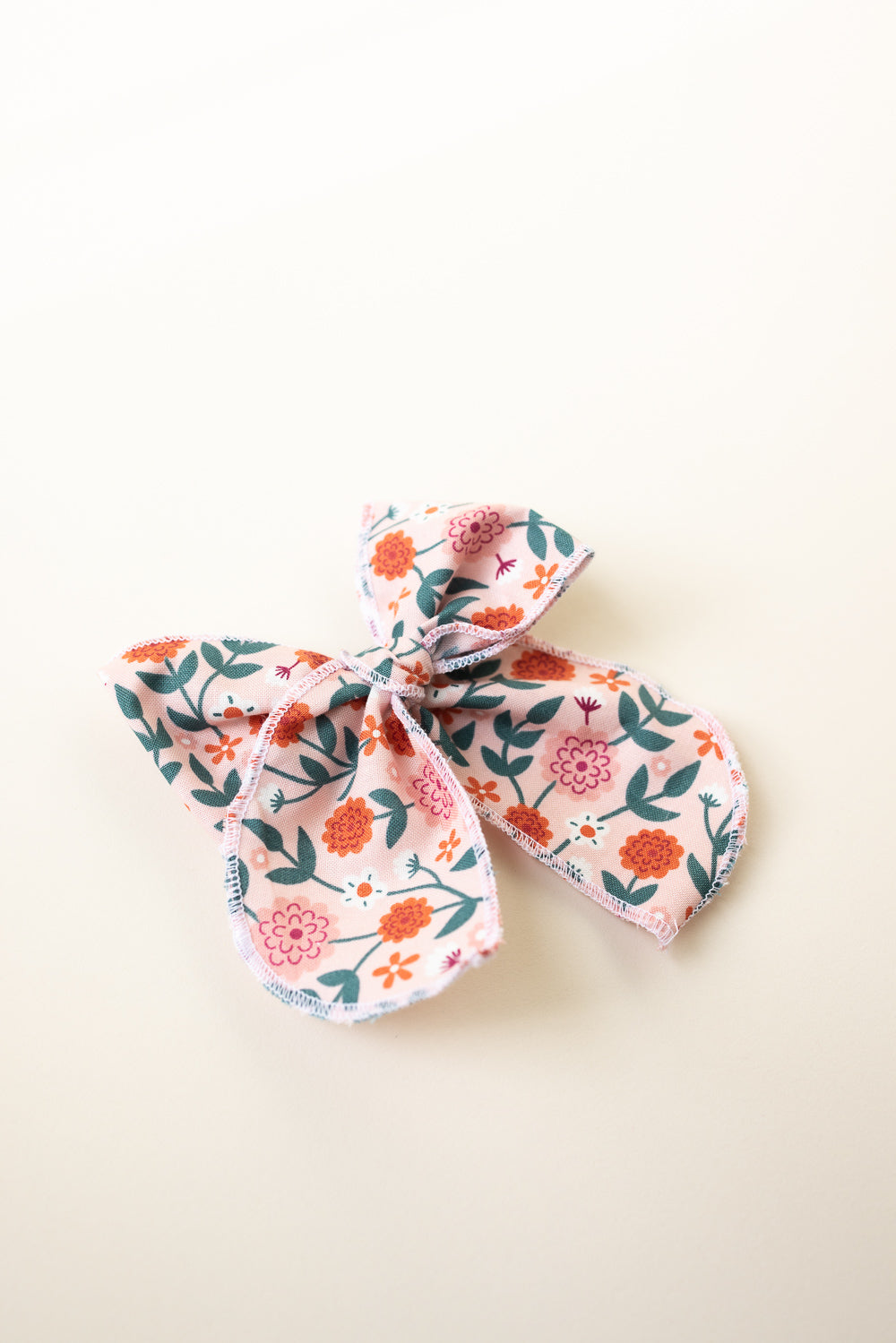Wild Flower Serged Trim Bow with Alligator Style Clip
